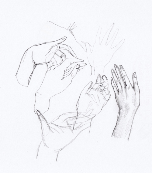 Pencil drawings of hands in sketchbooks showing movement
